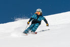 kid skiing in a blue camo and black jacket